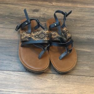 Brown and black strap sandals